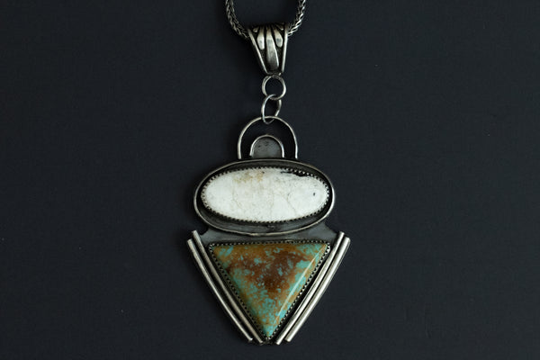 Close up of Royston Turquoise and White Buffalo pendant necklace showing stone pattern in sterling silver