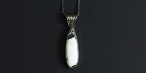 Handmade, sterling silver, white buffalo teardrop pendant on an 18” sterling silver oxidized wheat chain