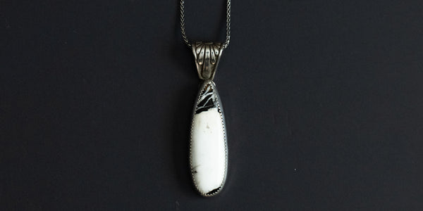 Handmade, sterling silver, white buffalo teardrop pendant on an 18” sterling silver oxidized wheat chain