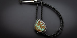 Handmade #8 turquoise bolo tie with twist wire detailing 