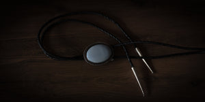 Handmade blue opal bolo tie in sterling silver with braided leather cord