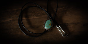 Handmade Royston turquoise bolo tie in sterling silver with braided leather cord