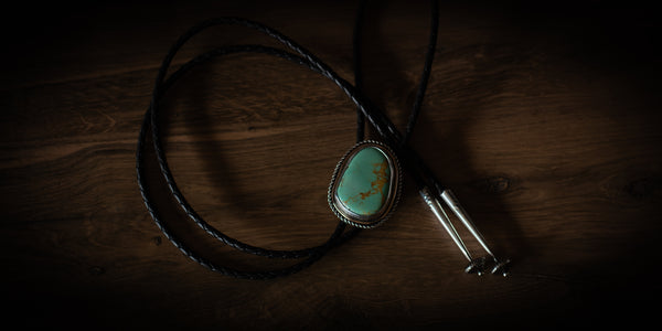 Handmade Royston turquoise bolo tie in sterling silver with braided leather cord