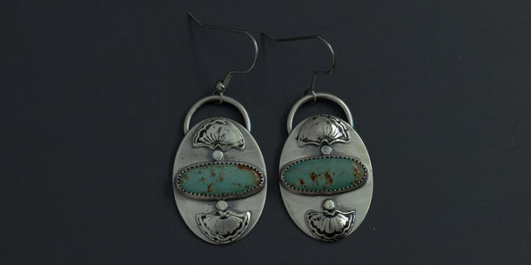 Green kingman turquoise stones set horizontally in .925 sterling silver handmade earrings with hand stamped fan details above and below the stone earrings side by side