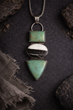 Front view of Kingman Turquoise White Buffalo sterling silver statement necklace