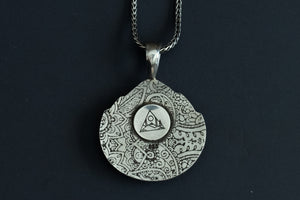back view of  a Handmade Starfox Variscite stone necklace in sterling silver with paisley design stamped onto back