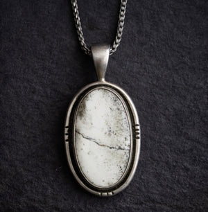 white buffalo stone necklace set in sterling silver