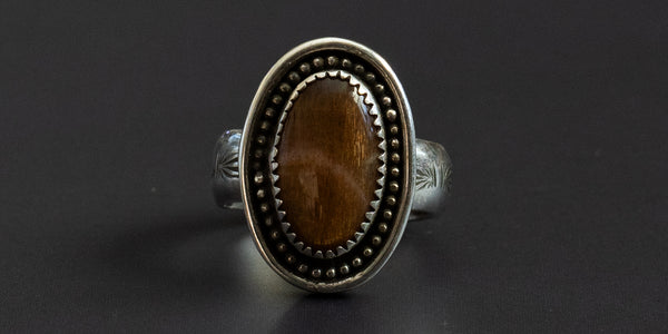 oval sunstone set in handmade ring of .925 sterling silver with a hand stamped ring band